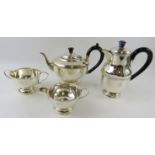 Four piece 1930s silver tea set with beaded decoration and bakelite handles. Hallmarked for