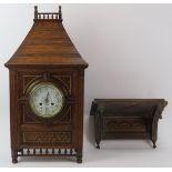 A large carved oak bracket clock, late 19th/early 20th century. With blue and white enamelled