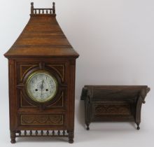 A large carved oak bracket clock, late 19th/early 20th century. With blue and white enamelled