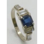 A white precious metal square sapphire and baguette cut diamond ring, the diamonds approximately 0.