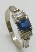 A white precious metal square sapphire and baguette cut diamond ring, the diamonds approximately 0.