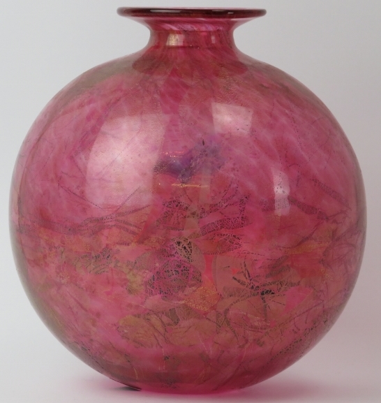 A large Isle of Wight mottled red and aventurine glass vase. Of globular form with factory label