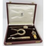 A 1970s Asprey & Co silver plated cocktail bar set in fitted case including ice tongs, champagne