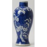 A Chinese blue and white porcelain meiping vase, 19th century. Decorated with blossoming prunus