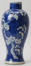 A Chinese blue and white porcelain meiping vase, 19th century. Decorated with blossoming prunus
