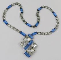 A Vintage Art Deco blue and white paste pendant necklace, mounted in white metal, 43cm long with a