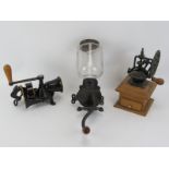 Three vintage coffee grinders. Comprising an Arcade and Spong & Co Ltd. wall mounting coffee grinder