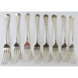 Set of 8 George III/IV silver table forks, hallmarked for 1818/1833, maker's marks rubbed. Length