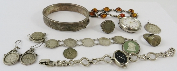 White metal items to include: an engraved silver hinged bangle, a silver cased pocket watch, another