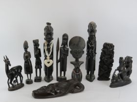 Tribal Art: A group of ten African carved and ebonised wood figures, late 20th century. (3 items)