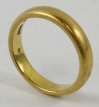 A gent’s 22ct yellow gold wedding band of court profile, finger size P, Hallmarked Birmingham