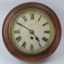 A mahogany wall clock, late 19th/early 20th century. With Roman numeral dial and hinged brass bezel.