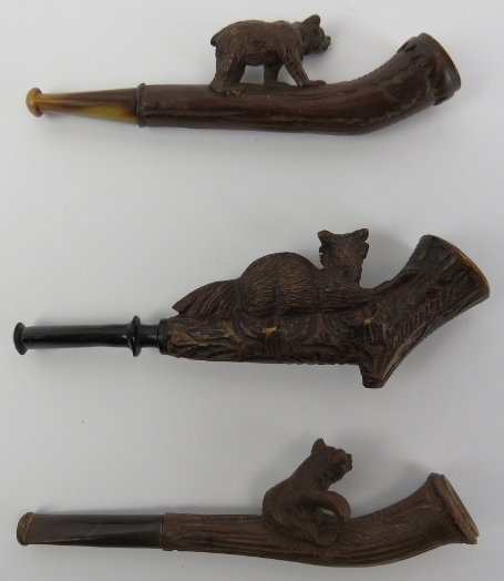 Three Black Forest carved cheroot pipes. Two surmounted with bears and the other with a recumbent - Image 2 of 3