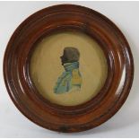 A framed miniature silhouette/watercolour. W M Berry 1917. 8cm diameter. Condition report: No issues