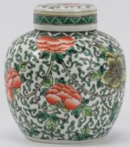 A Chinese famille verte ginger jar, late 19th/early 20th century. Overglaze decorated with flowers