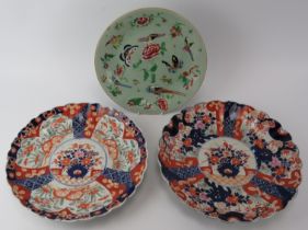 A Chinese enamelled celadon plate, 19th century and two Japanese Imari scalloped plates, late