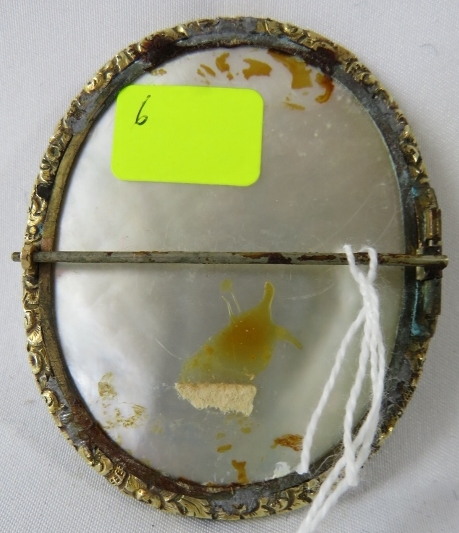 A 19th century miniature on mother of pearl, 'Study of a young lady in blue dress', unsigned. 6cm - Image 2 of 2