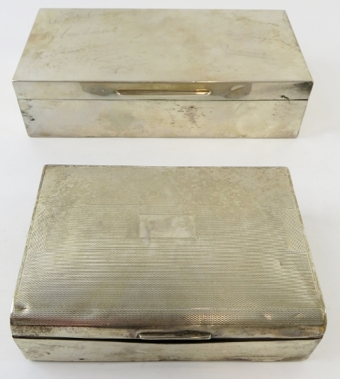 Two silver cigarette boxes, one bearing engraved signatures. Hallmarked for Birmingham 1932 and