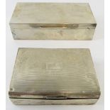 Two silver cigarette boxes, one bearing engraved signatures. Hallmarked for Birmingham 1932 and