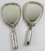 Two novelty Italian silver mirror shaped powder compacts with lipstick holder handles. Each