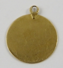 A libra yellow metal pendant, 21.5mm diameter, gross weight 2.5gms. Condition report: some wear to - Image 2 of 2