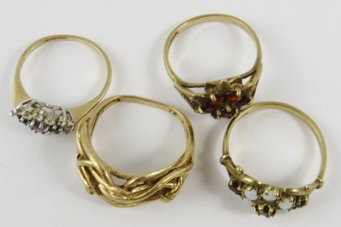 Four 9ct yellow gold rings, variously set with opals, garnets, amethyst and one wirework, gross - Image 2 of 2