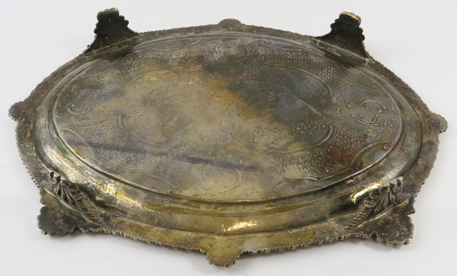 An ornate George III oval silver salver standing on four foliate feet and having a gadrooned, - Image 3 of 4