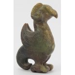 A Chinese archaistic jade carving of a zoomorphic creature. Formed as a bird with rams horns,