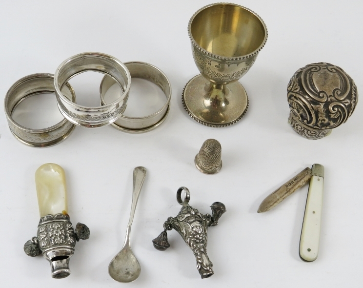 Mixed silver items including napkin rings, egg cup baby rattles thimble, fruit knife and perfume - Image 2 of 3