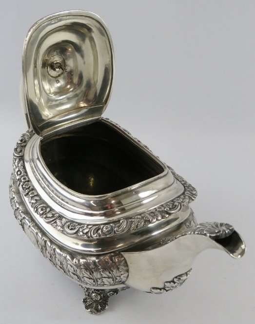 A late George III ornate silver teapot with acanthus and scallop decoration standing on a four - Image 3 of 5