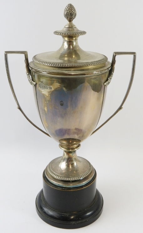 A lidded silver sports trophy with double acanthus leaf handles, pineapple finial and gadrooned - Image 3 of 5