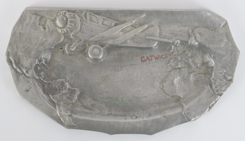 Aviation memorabilia: A ‘Miss Columbia’ cast gas tank metal transatlantic flight souvenir ashtray.