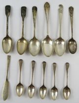 A mixed lot of 11 silver spoons and a silver butter knife. All fully hallmarked including Newcastle.