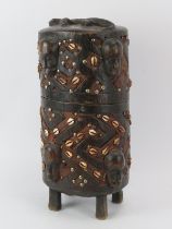 Tribal Art: A West African carved wood reliquery box and cover. With masks and a crocodile carved in