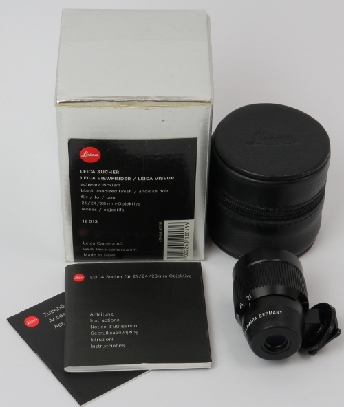 A Leica black viewfinder for 21/24/28mm camera lenses. Leica case and box included. Model: 12013.