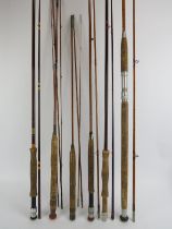 Six vintage fly fishing rods. Notable rods include ‘The Perfection’ Palakona split cane rod and a ‘