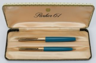 A vintage Parker 61 fountain pen and propelling pencil, circa 1960s. Vista blue with 12ct rolled