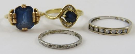 Two synthetic sapphire rings; a diamond half-hoop ring; and another platinum ring set with diamond