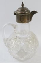 A late Victorian silver mounted cut glass claret jug, hobnail cut with gothic crosses. Hallmarked