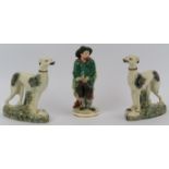 Two Staffordshire porcelain greyhounds and a Derby porcelain works figurine, 19th century. Derby