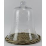 A large engraved glass cheese bell. Engraved with a laurel wreath. 34 cm height, 29.8 cm diameter.