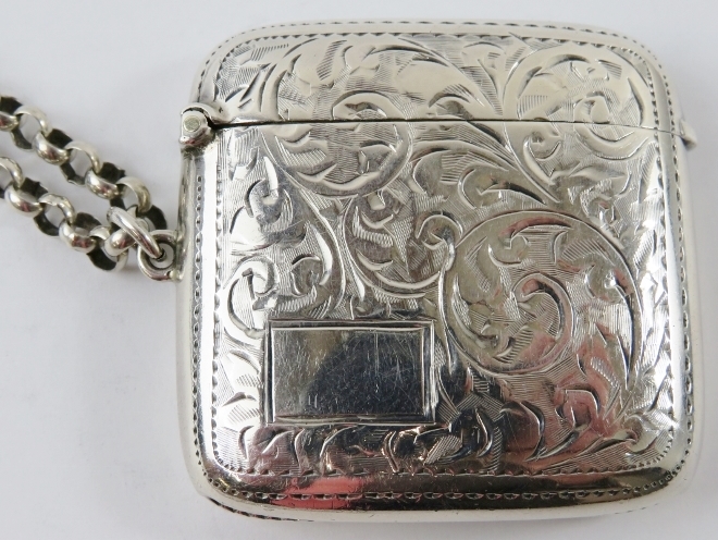 An engraved silver vesta case on an unmarked white metal keep chain. Vesta case hallmarked for - Image 2 of 3