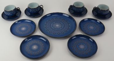 A Denby Midnight pattern part tea service. Comprising four teacups and saucers, four side plates and