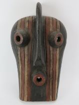 Tribal Art: An African carved and painted wood mask, Songye people, Congo. 47 cm height. Condition