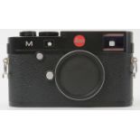 A Leica M TYP 240 black finish digital rangefinder camera body. Box with accessories, carry strap
