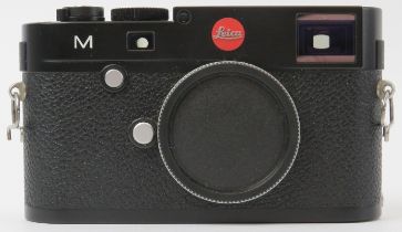 A Leica M TYP 240 black finish digital rangefinder camera body. Box with accessories, carry strap