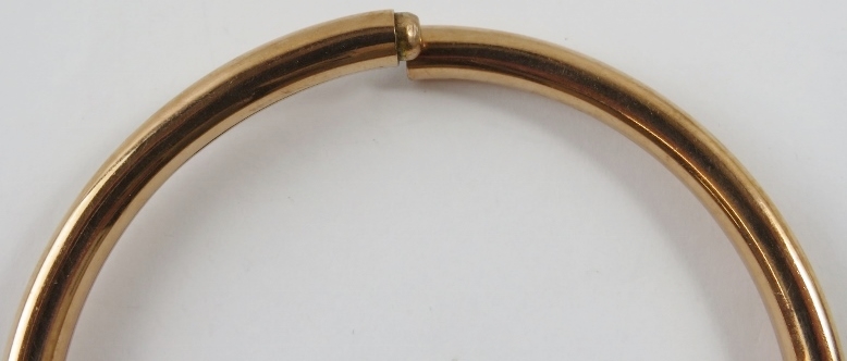 A 9ct rose gold hollow circular bangle tension sprung, 8.5cm external diameter - Image 2 of 2