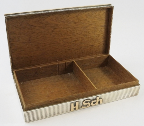 A silver and gold cigarette box with reeded finish and monogram mount. Cedar lined. 18.5cm x 10cm. - Image 2 of 3