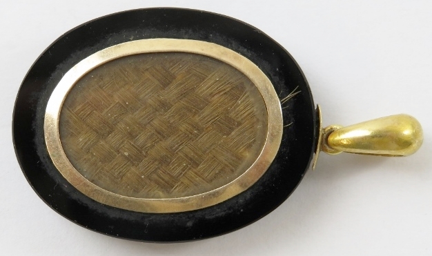 A Victorian onyx and seed pearl mourning locket with woven hair panel to reverse and hoop bale - Image 2 of 3