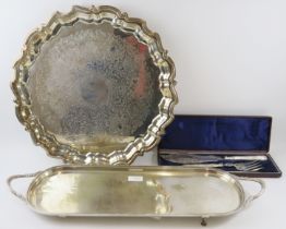 A large silver plated Georgian style salver (45cm diameter), a long two handled serving tray and a